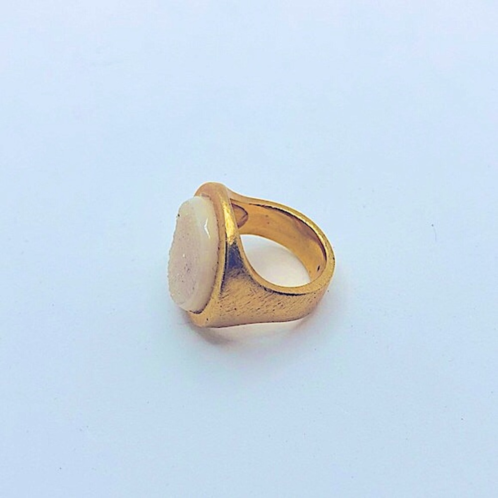 - Marcia Moran cute white ring